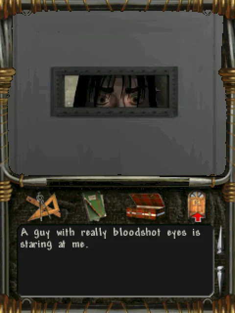 Bloodshot eyes through a cell door