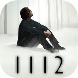 A man sitting in the snow above the 1112 logo